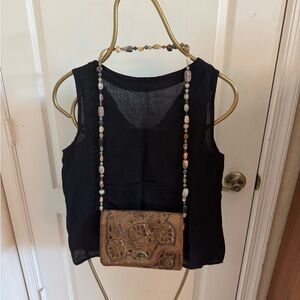 Vintage hand-tooled leather bag with agate beggar’s beads strap